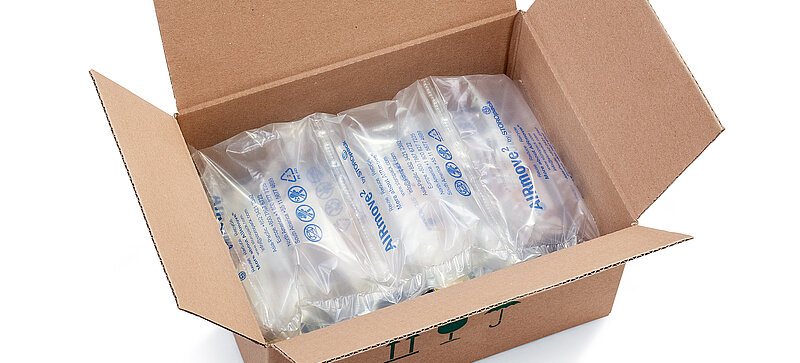 
		  A cardboard box containing air cushions