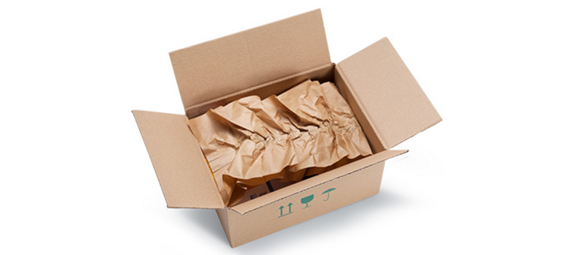 
		  A cardboard box containing brown paper cushioning